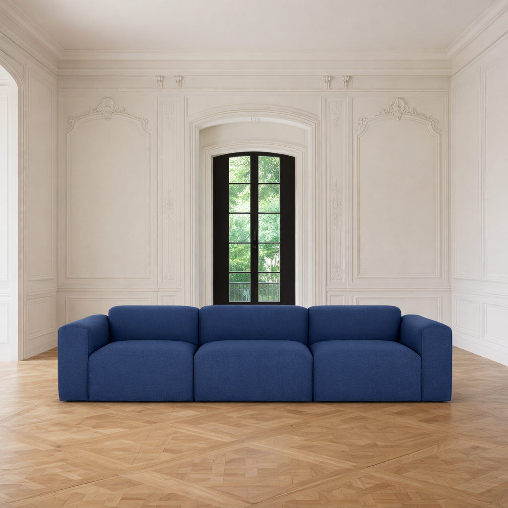 Porventura Deep sofa with plush cushions and modern design, shown in a cozy living room setting.
