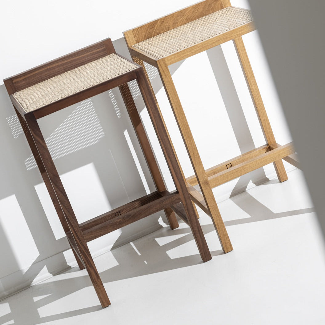 Porventura Alto stool with wooden legs and upholstered seat, modern design perfect for kitchen or bar area.