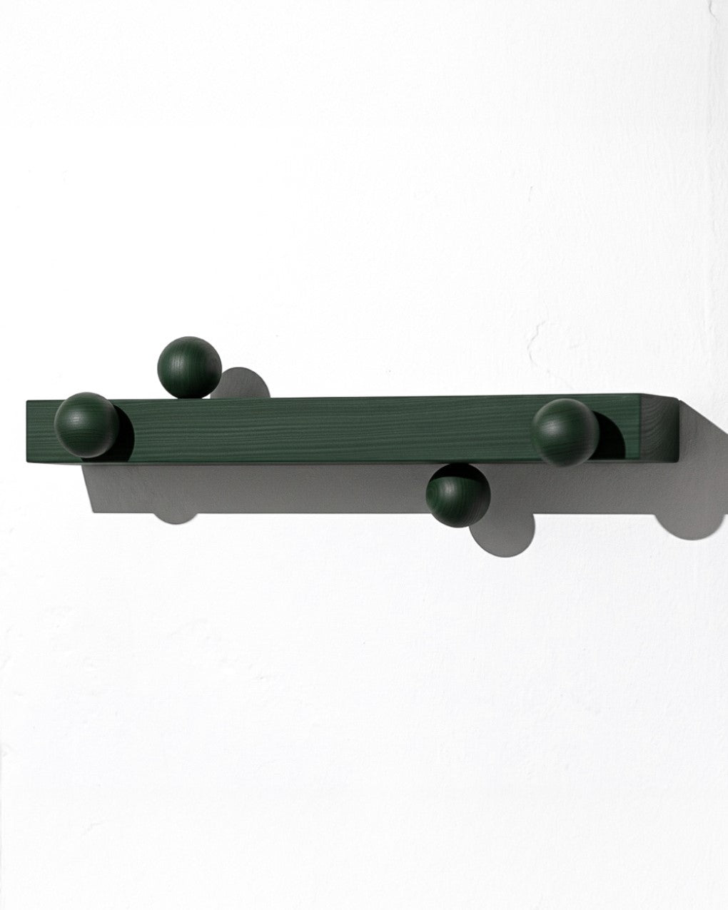 Solid wood hanger by João Xará with a sturdy, natural finish, suitable for hanging clothes in a stylish, minimalist wardrobe.