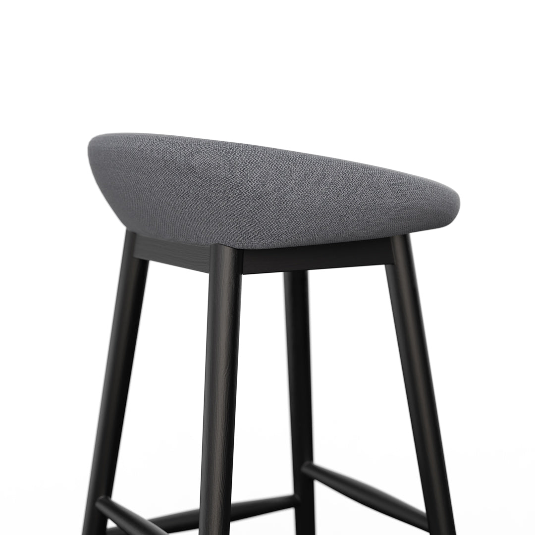 Porventura cake-shaped stools in black, featuring a playful design perfect for modern home or cafe decor.