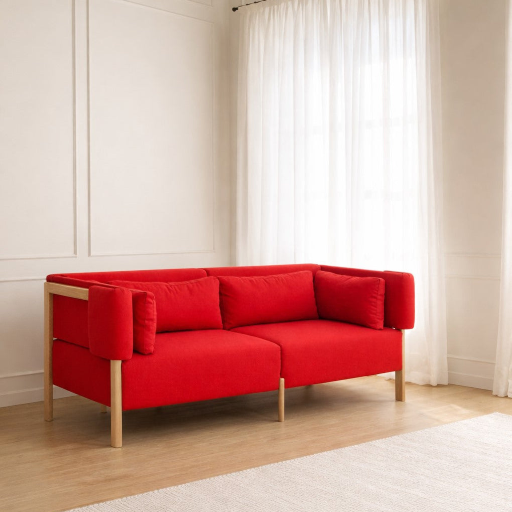The COD sofa by Porventura, designed by Filipa Aguiar & João Pereira, combines an exposed beech wood frame with soft, inviting upholstery. Clean lines and balanced proportions define its contemporary character, bringing comfort and understated elegance to the living space.