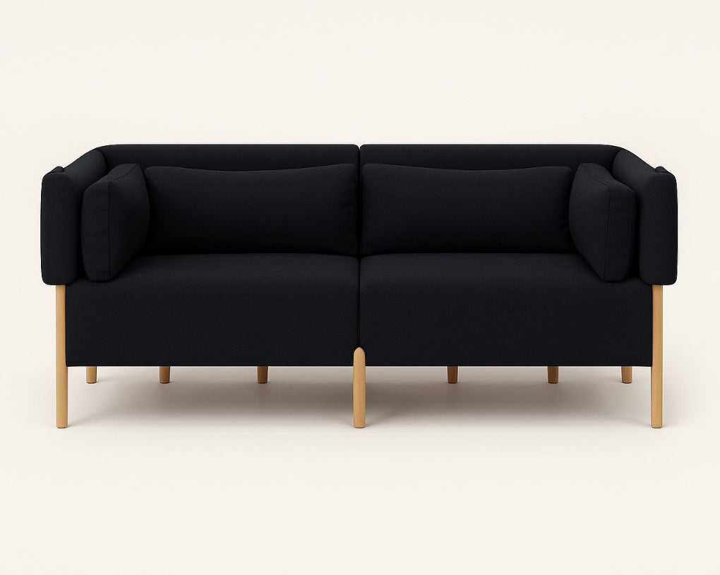 The COD sofa by Porventura, designed by Filipa Aguiar & João Pereira, pairs an exposed beech wood frame with Camira ERA Forward – Black upholstery. Its contemporary design, balanced proportions and soft cushions create an inviting centrepiece for a modern living space.
