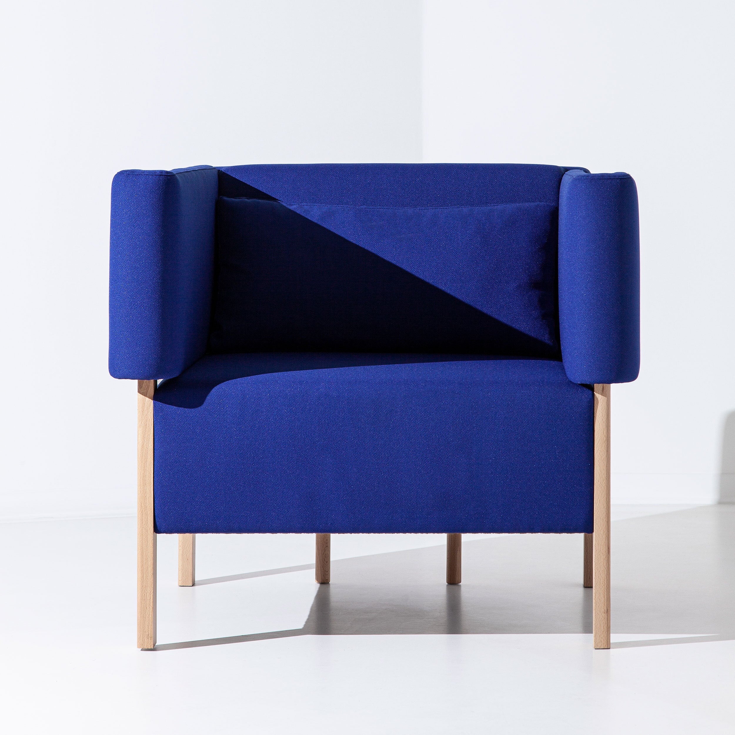 Filipa Aguiar & João Pereira Cod One Seater sofa with modern design, featuring plush upholstery and sleek wooden legs.