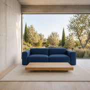 Porventura DEEP sofa, featuring soft upholstery and a contemporary design, shown in an inviting living room setting.