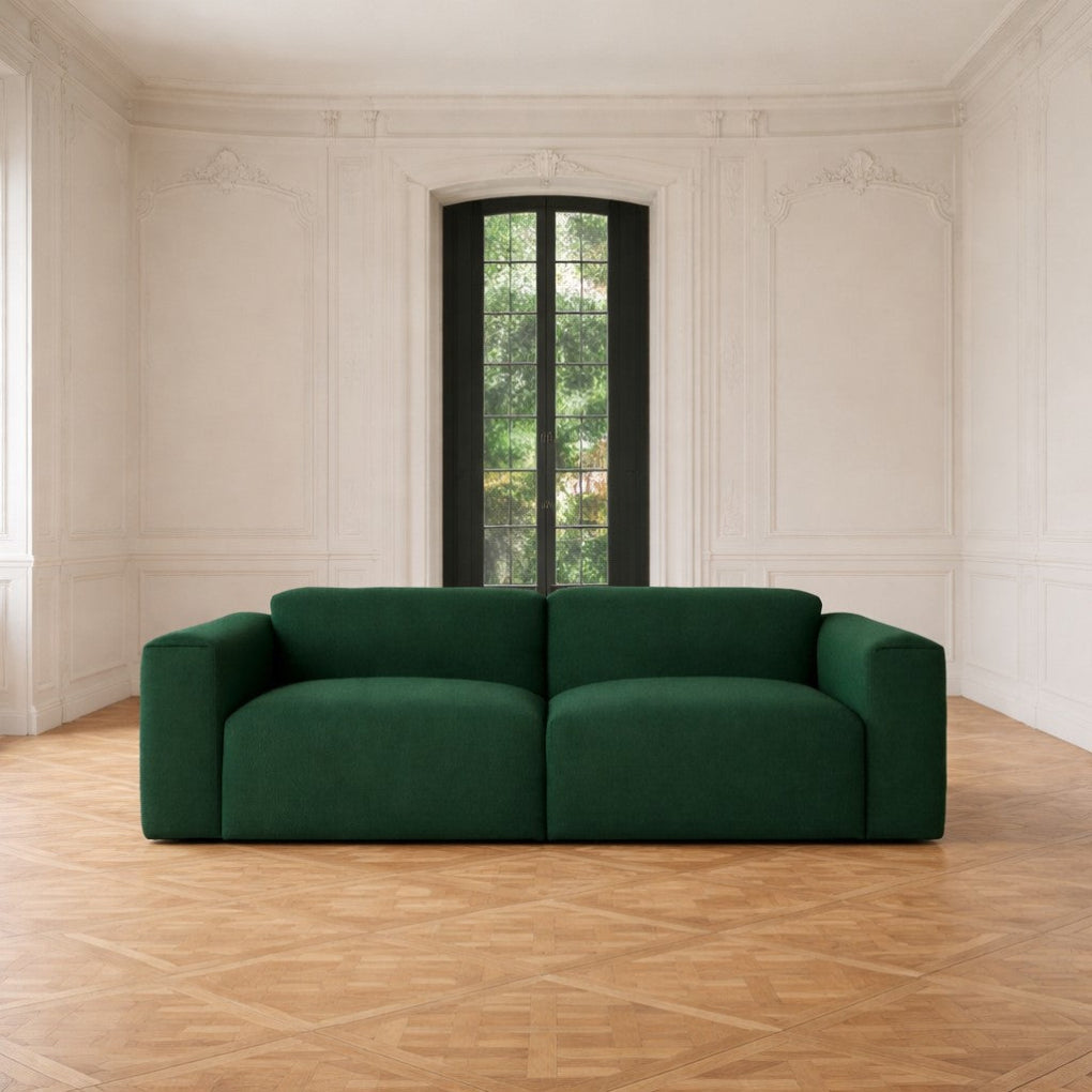 Porventura DEEP modular sofa, upholstered in green Camira Era Signature fabric, with a contemporary design that brings comfort and a relaxed character to living spaces.