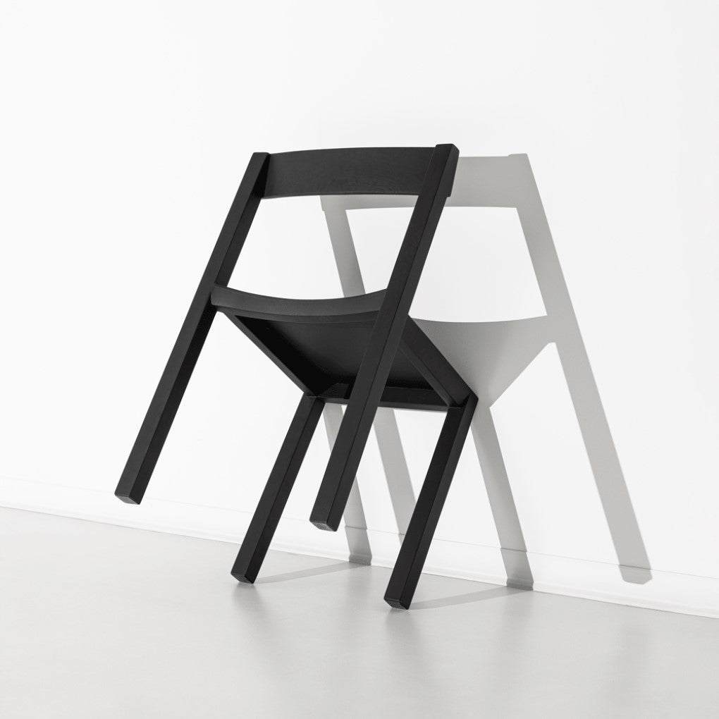 JBNG Studio FORMAL chair with sleek design, featuring a wooden seat and modern wooden legs for elegant dining use.