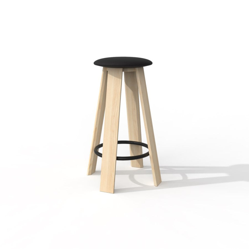 The LINEAR stool, designed by Daniel Vieira for Porventura, combines an ash wood frame with a black upholstered seat and a black metal footrest ring, bringing warmth and elegance to contemporary interiors.