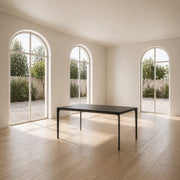 Porventura SHADE table, crafted from ash wood in natural or black-painted finishes, with clean lines and a minimalist design that highlights the wood’s distinctive grain.