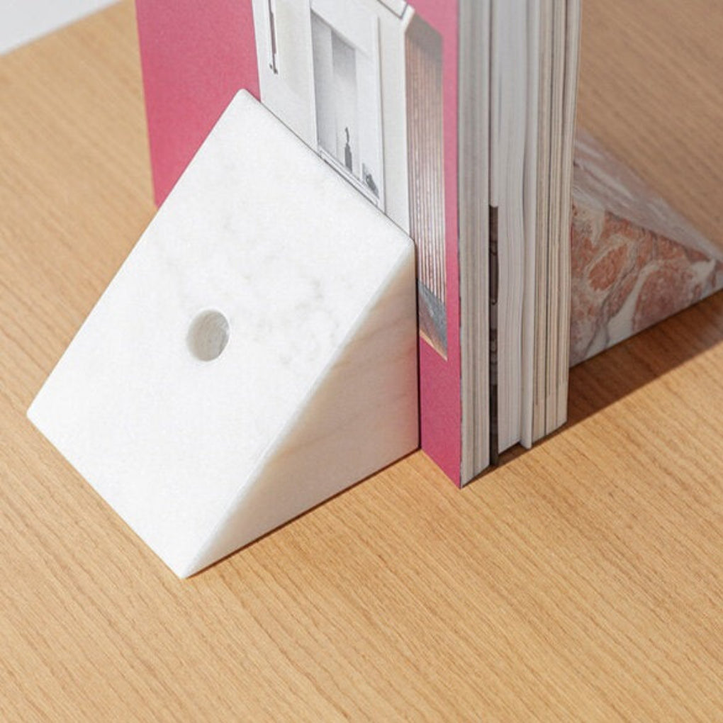 Porventura STRIKE+SPARE bookend, crafted in marble with a bold form that brings character and balance to any book arrangement.
