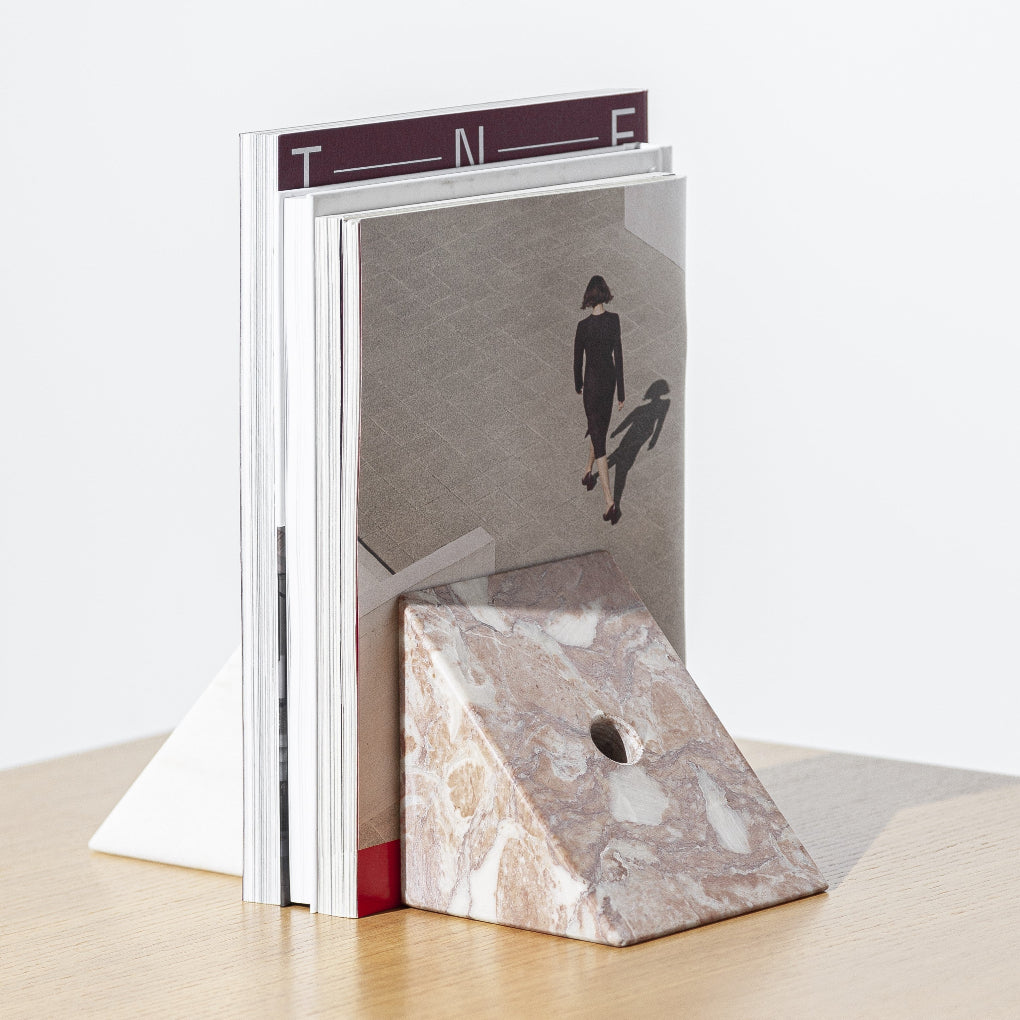 Porventura STRIKE+SPARE bookend, a marble accessory defined by its clean geometry and understated presence alongside books.