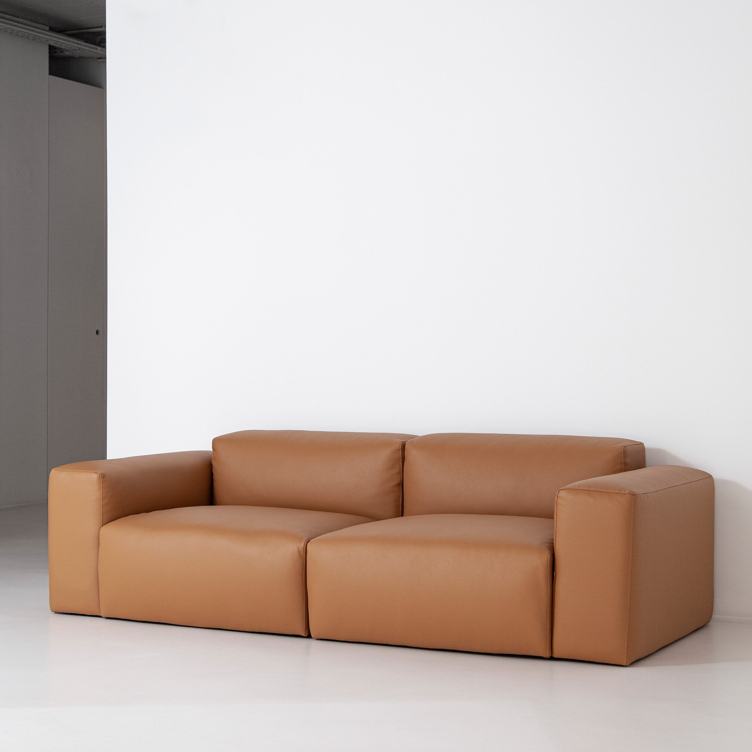 Porventura Deep sofa showing plush, deep cushions and modern design in a neutral fabric for comfortable seating.