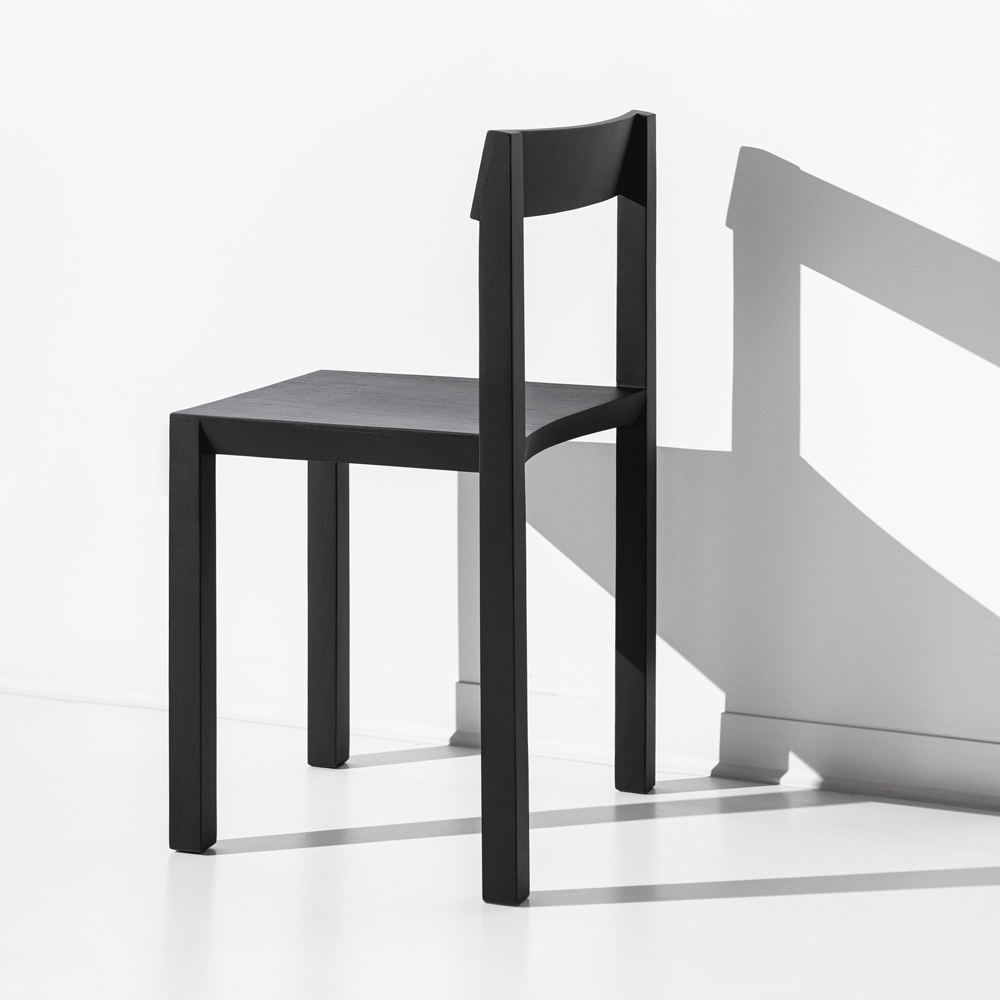 JBNG Studio formal chair with sleek design and cushioned seat, ideal for modern office or dining room decor.