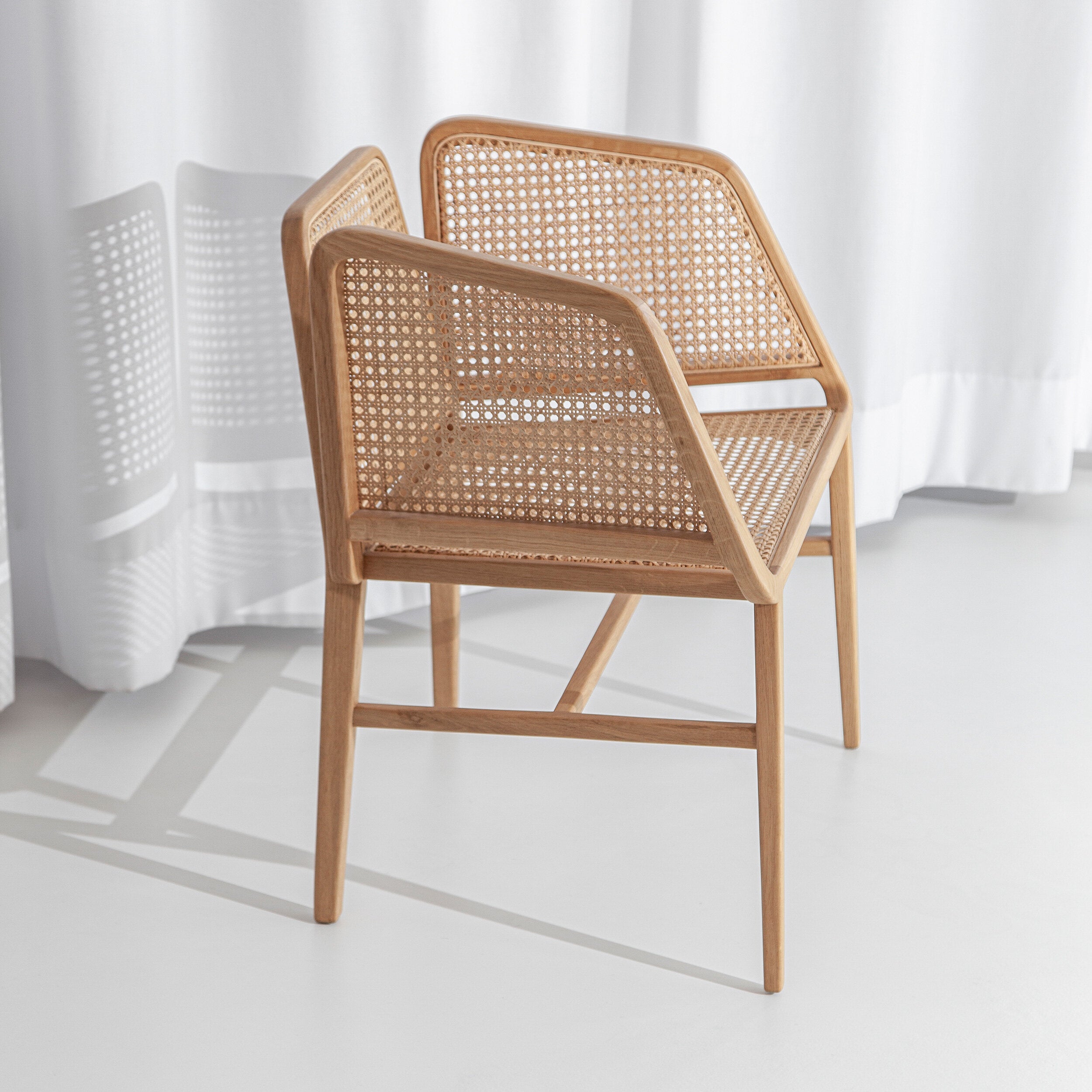 Porventura Bee chair with a sleek, modern design featuring smooth curves and a vibrant yellow finish.