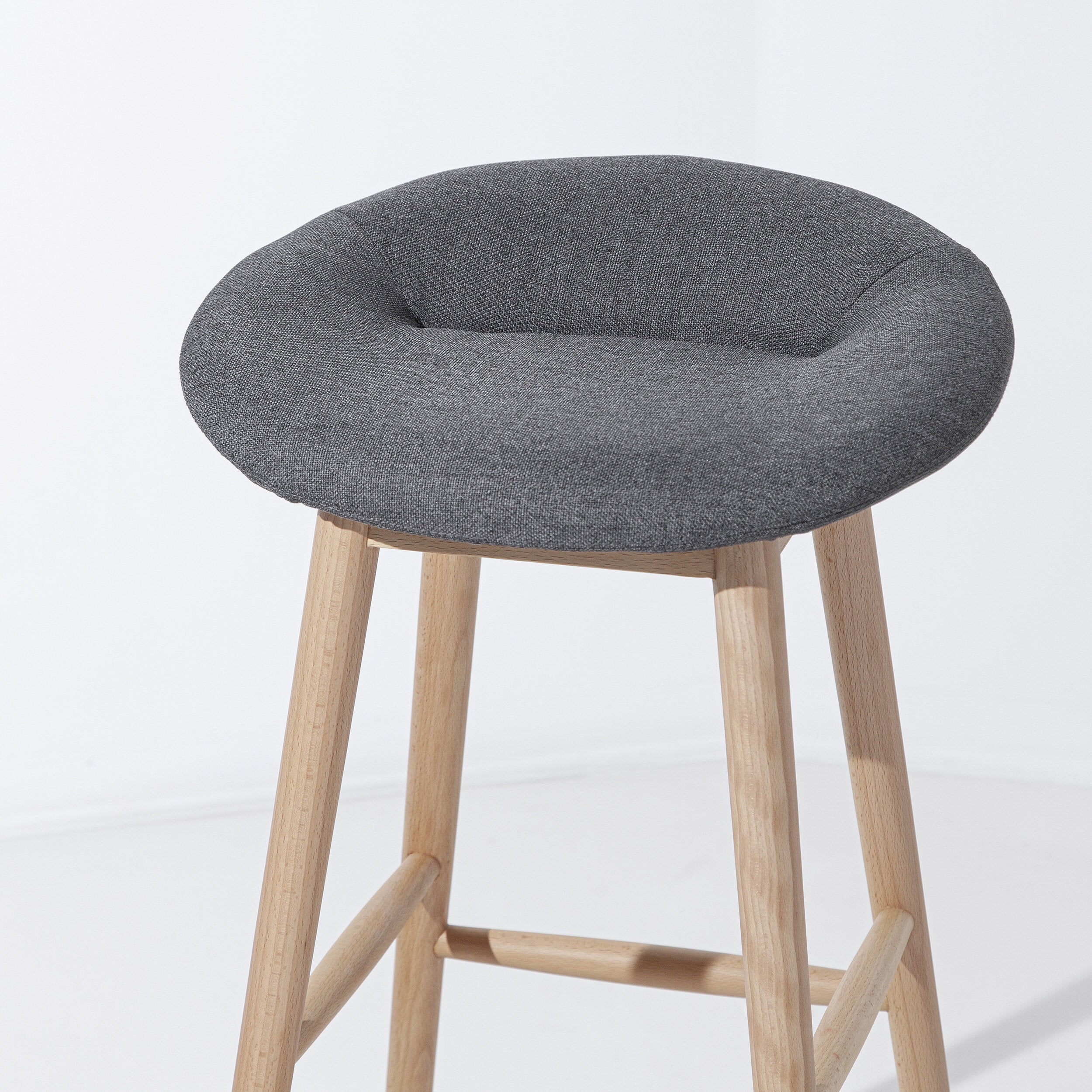 Porventura cake-shaped stools with colorful, detailed designs, perfect for adding a playful touch to modern interior decor.