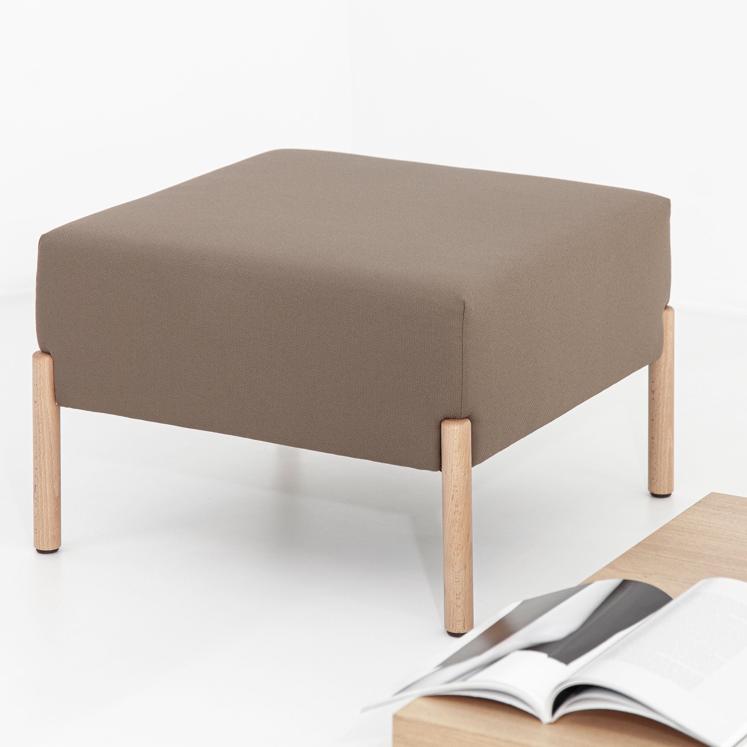 Porventura Cod Ottoman sofa accessory featuring a sleek, modern design in a neutral fabric, perfect for living room decor.