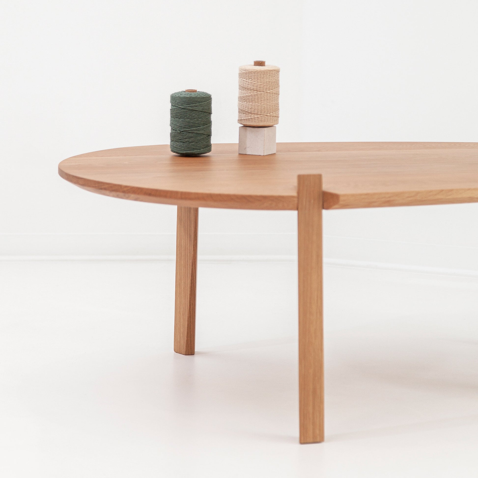 Modern Fenda coffee table by Cátia Moura featuring a sleek, minimalist design with a smooth wooden surface and sturdy legs.