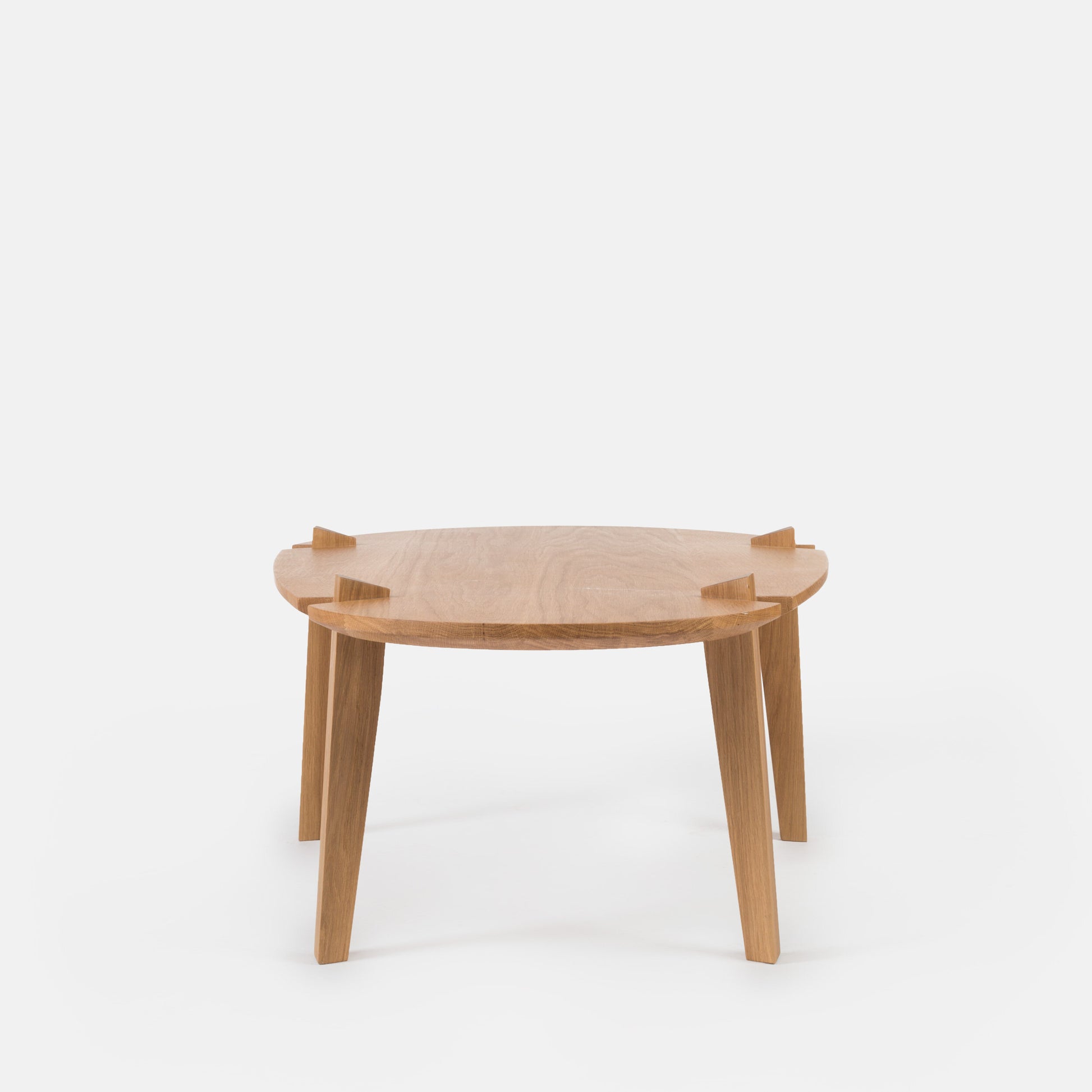 Modern Fenda coffee table by Cátia Moura featuring a sleek design and smooth surface in a stylish living room setting.