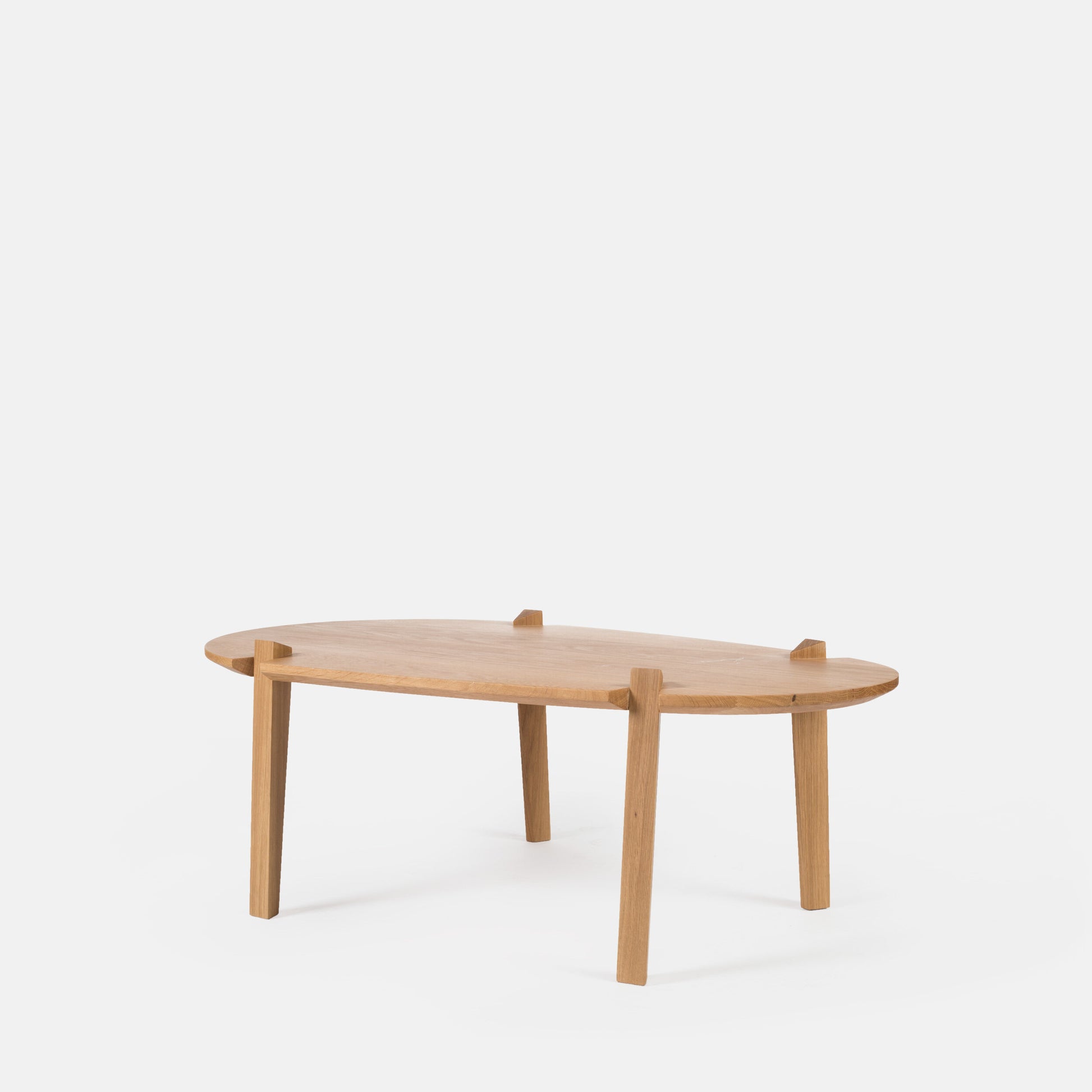Cátia Moura Fenda coffee table with sleek wooden surface and modern design, shown from a perspective view.