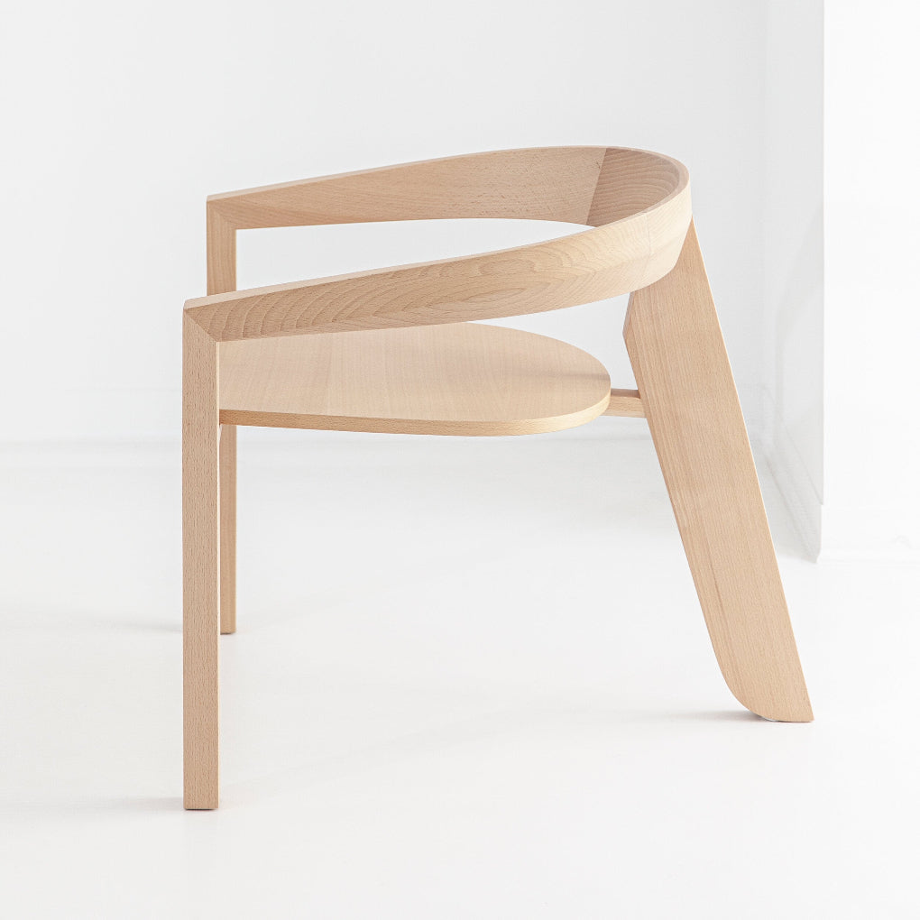 The ICON LOUNGE chair by Porventura, with clean lines and an elegant silhouette, shown in a contemporary living space.
