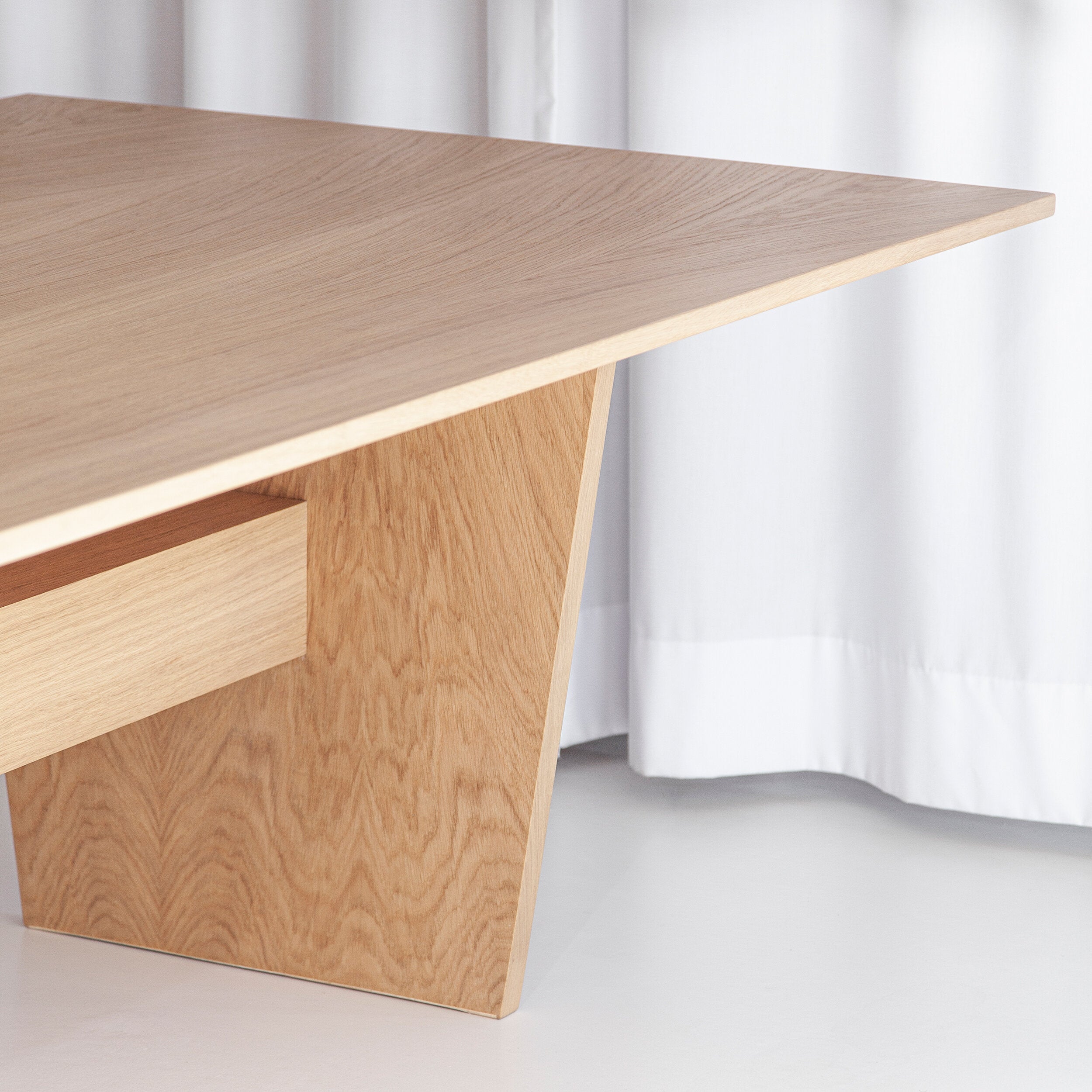 Porventura Nova table with sleek wooden surface and modern design, shown from a top view in the image.