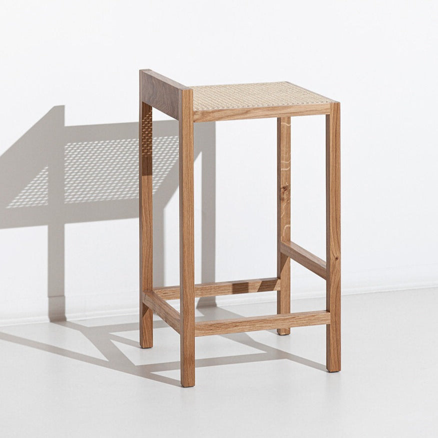Porventura Alto stool with sleek design, featuring a wooden seat and metal legs, modern aesthetic for stylish seating.
