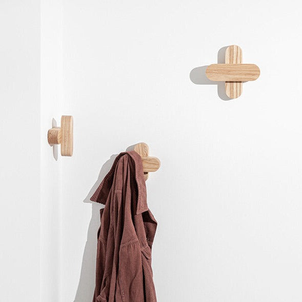 Porventura Plus hanger hanging on a closet rod, showcasing its sturdy design and smooth finish for organized clothing storage.