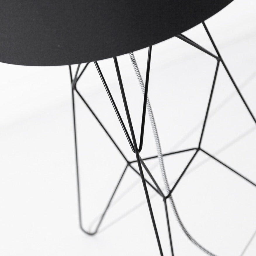 Porventura Tension lighting fixture with sleek modern design, showcasing adjustable arm and contemporary style in a well-lit setting