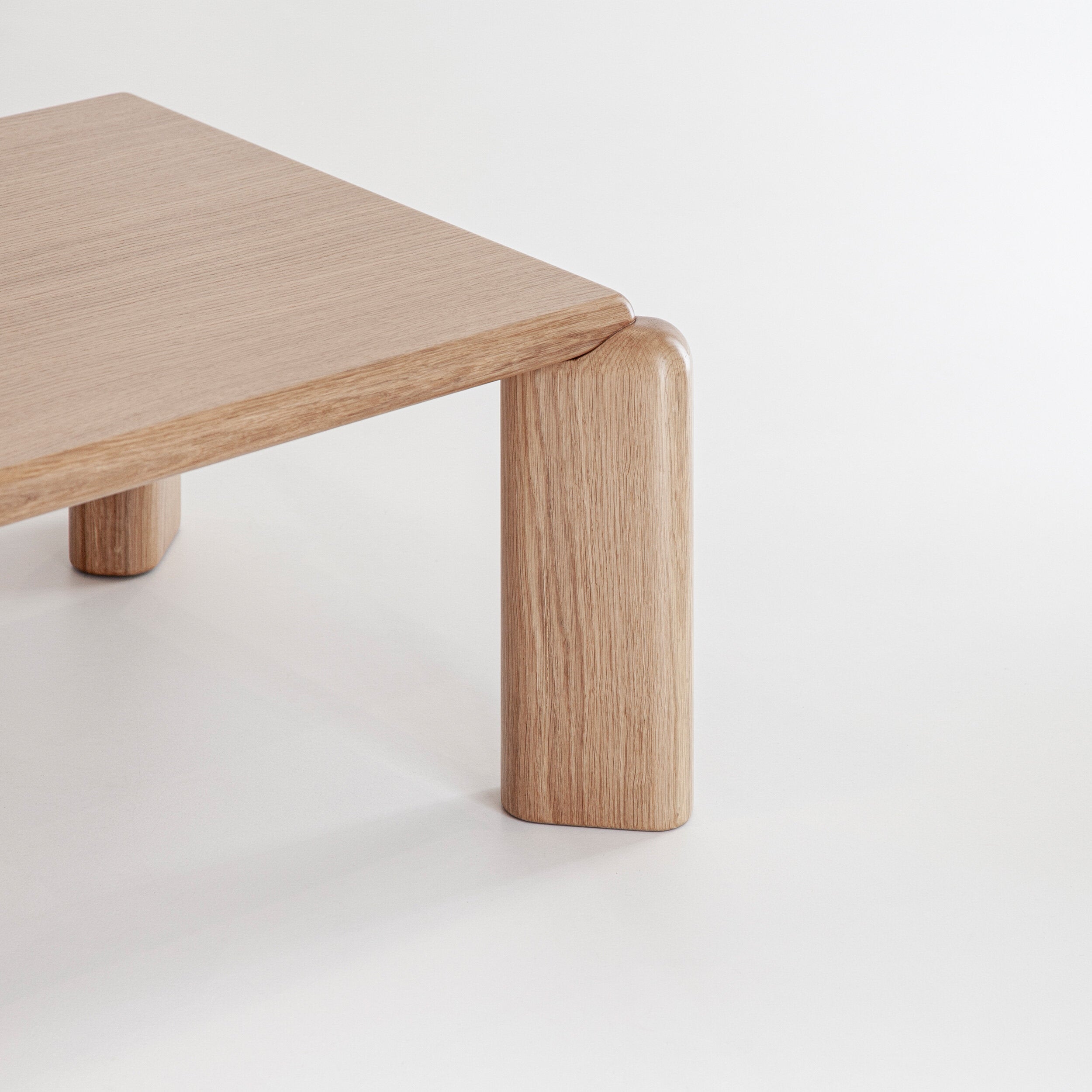 Porventura Soften coffee table with sleek wooden surface and modern design, shown in a well-lit room setting.