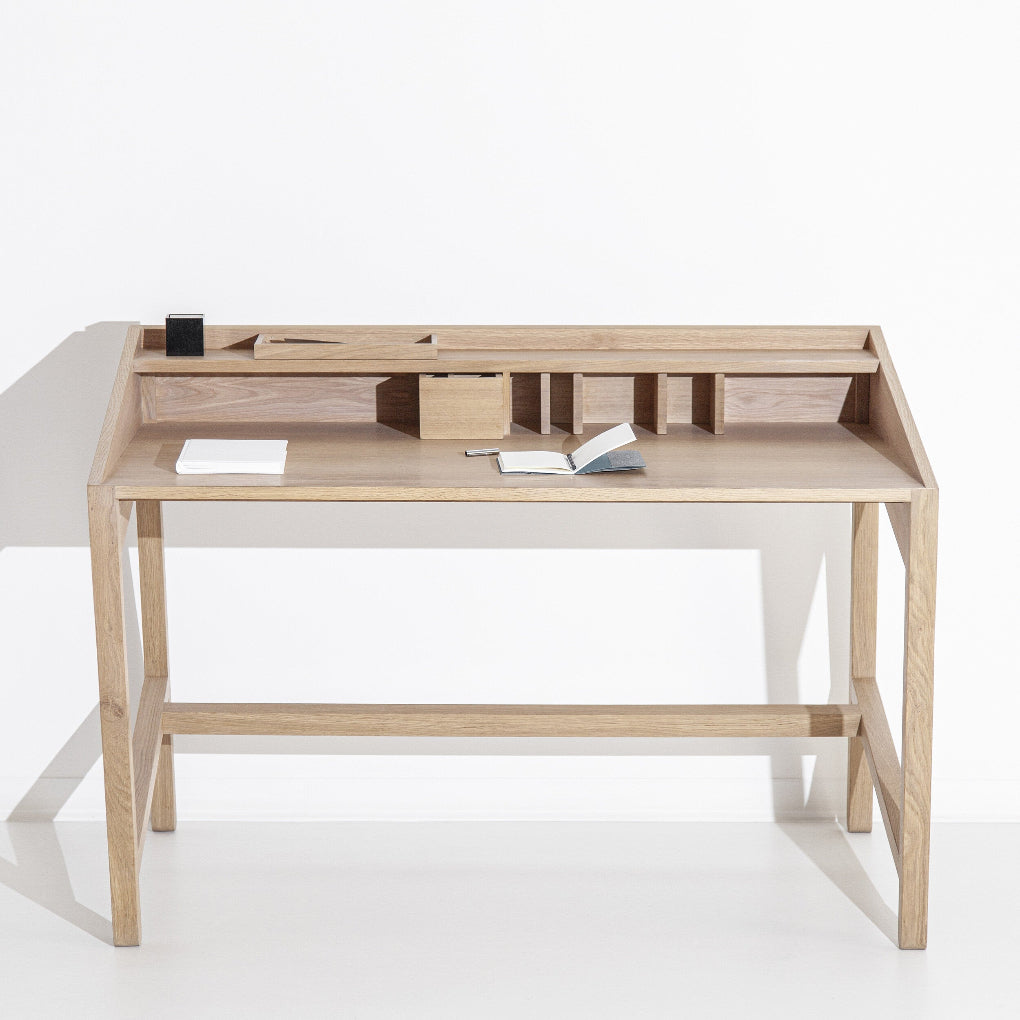 Elegant wooden table from Miguel Soeiro Torta collection with a smooth, polished surface and sturdy design, ideal for workspace.