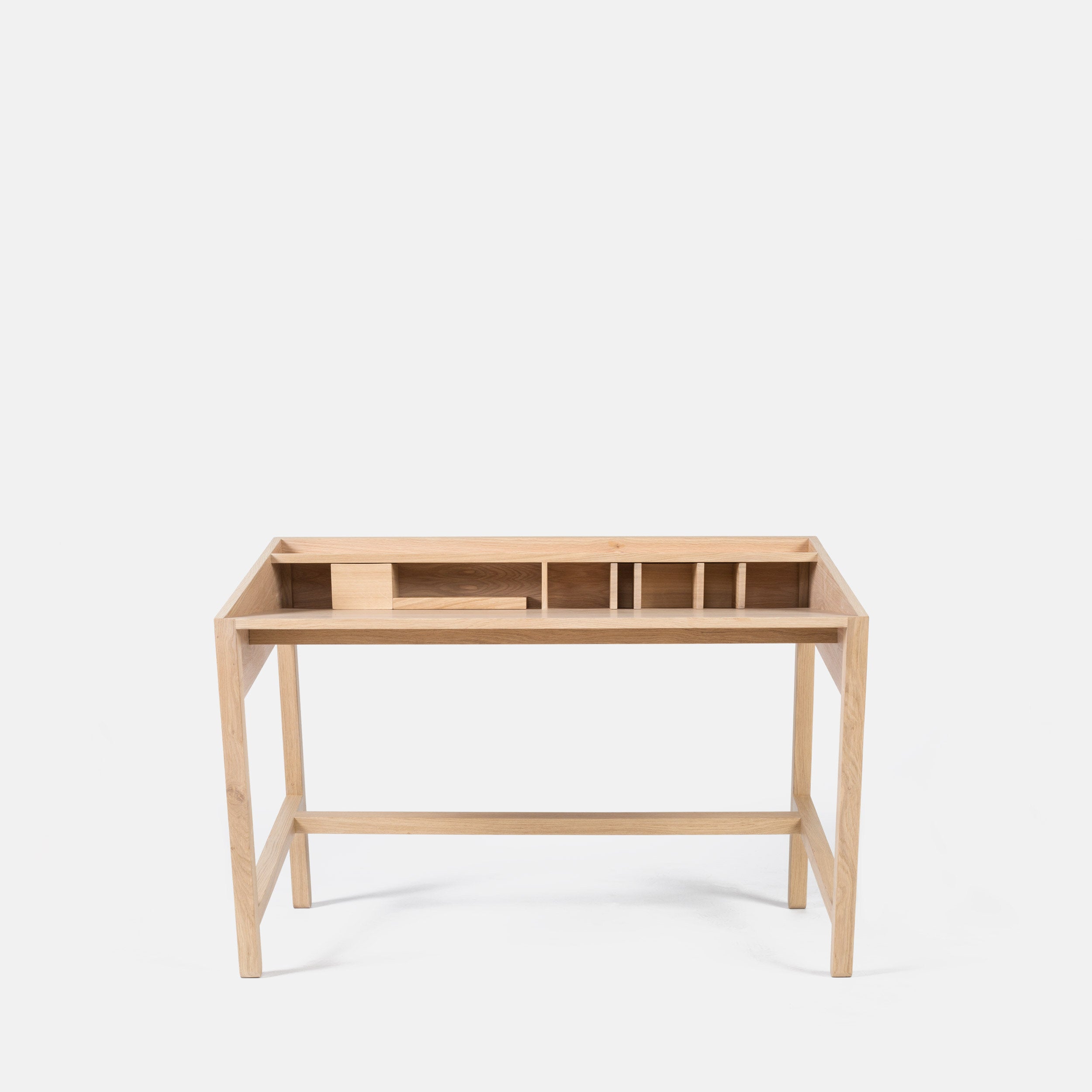 Miguel Soeiro Torta table with a smooth wooden surface and modern design, shown from the front view.