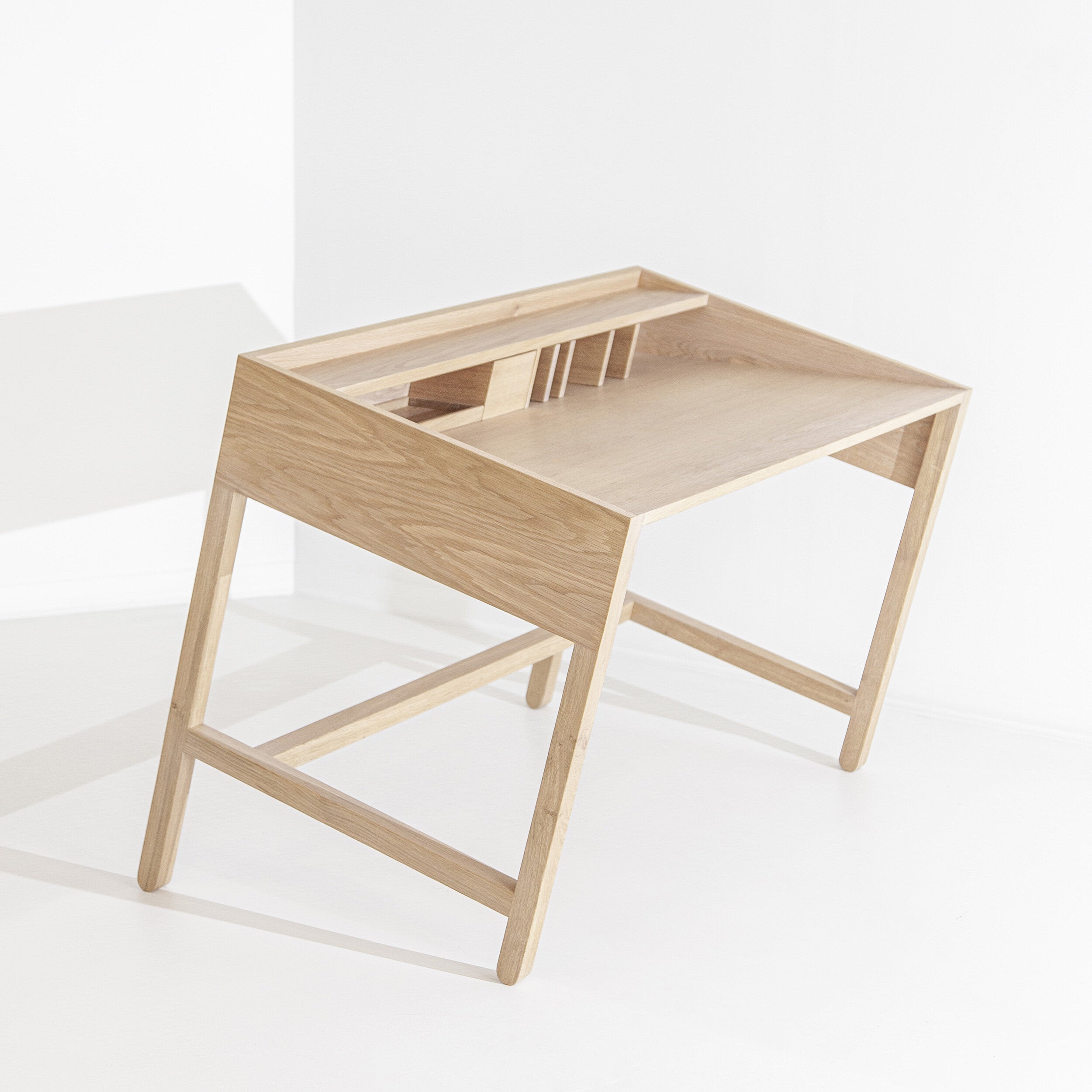 Miguel Soeiro Torta wooden table with detailed craftsmanship, featuring a smooth tabletop and sturdy legs, ideal for dining or work.