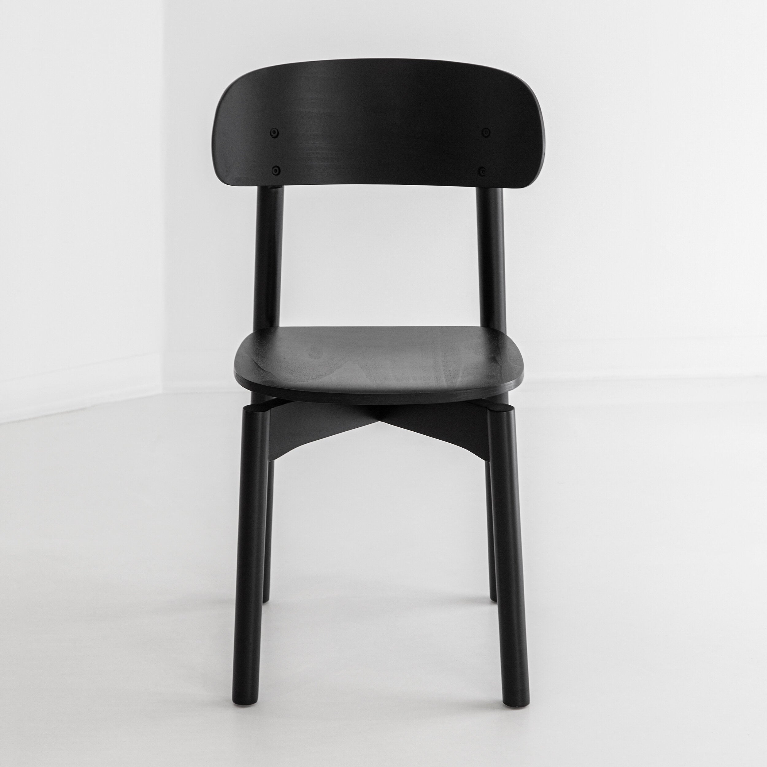 Porventura Woody chair with wooden frame and cushioned seat, showcasing its stylish and comfortable design.