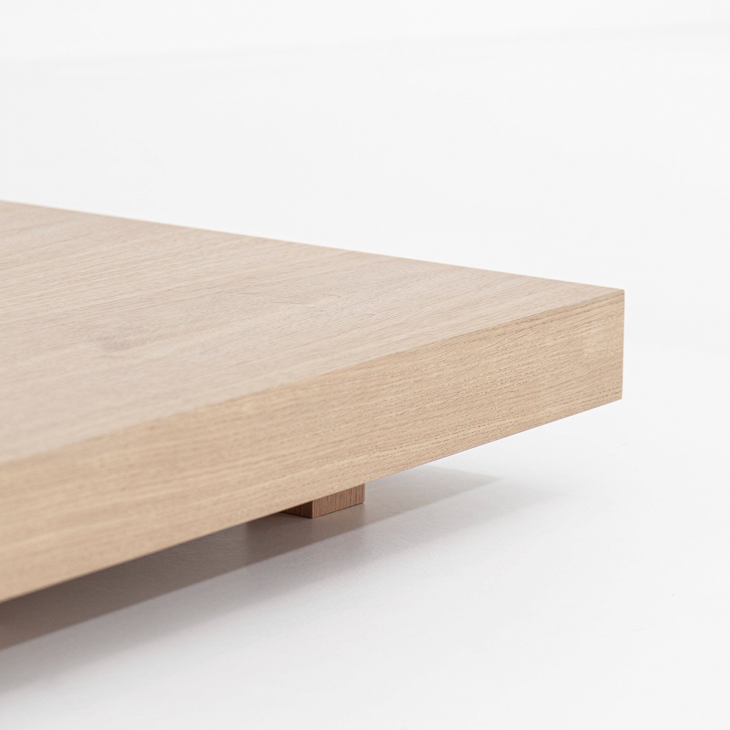 Porventura Zeus coffee table with sleek wooden surface and modern design, showcasing its elegant and sturdy craftsmanship.