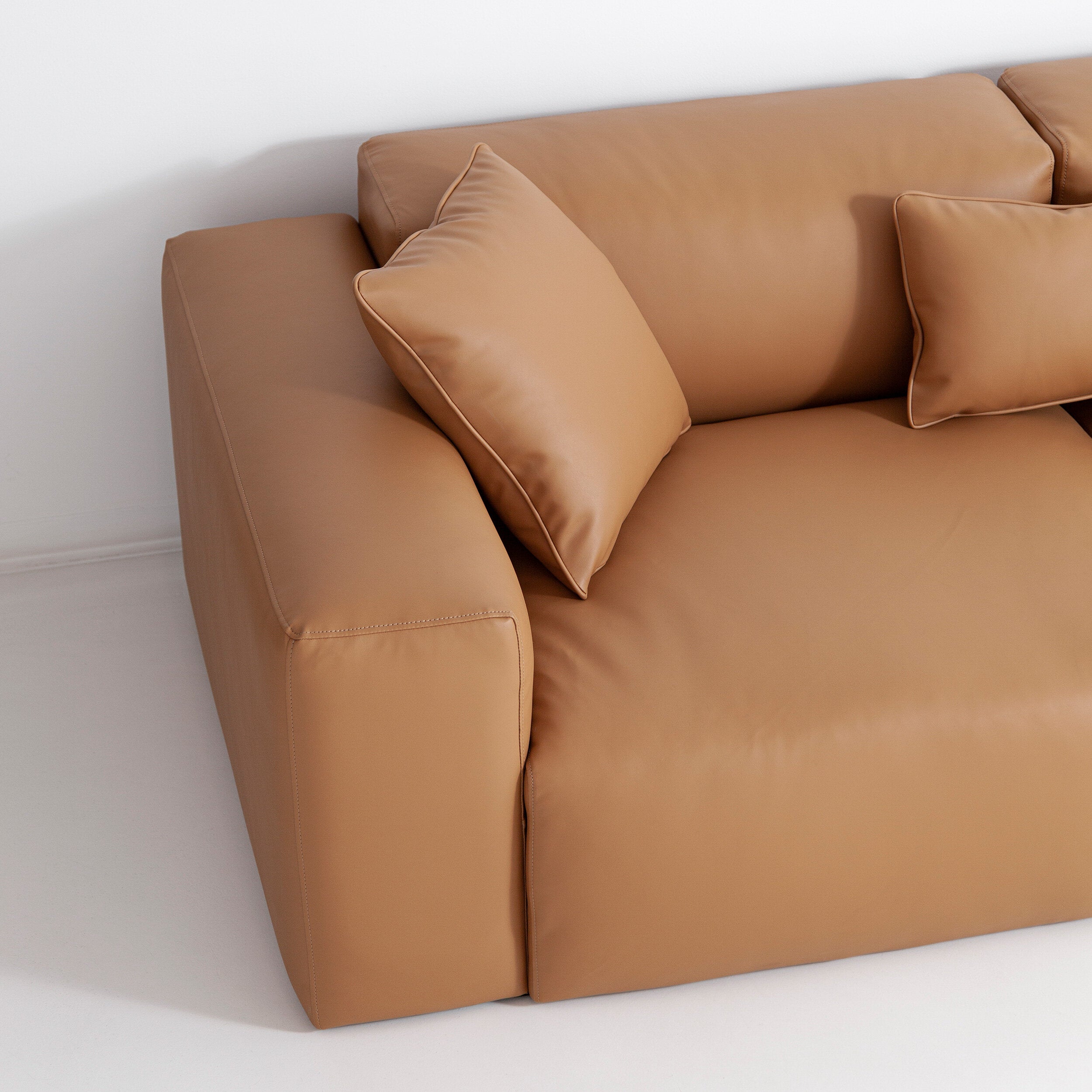 Porventura Deep sofa with plush upholstery and modern design, shown in a cozy living room setting.