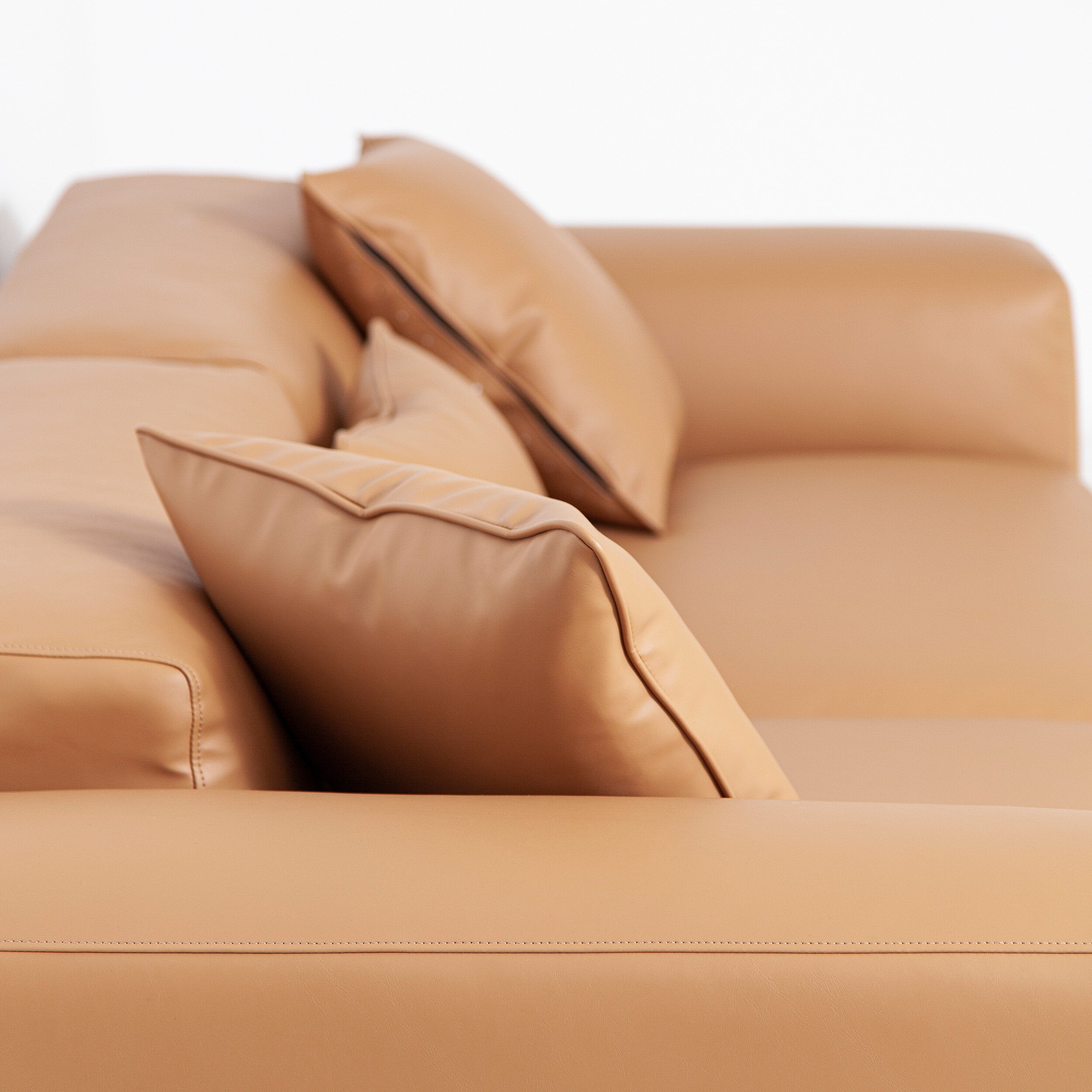 Porventura Deep sofa with plush cushions and modern design, shown in a cozy living room setting.