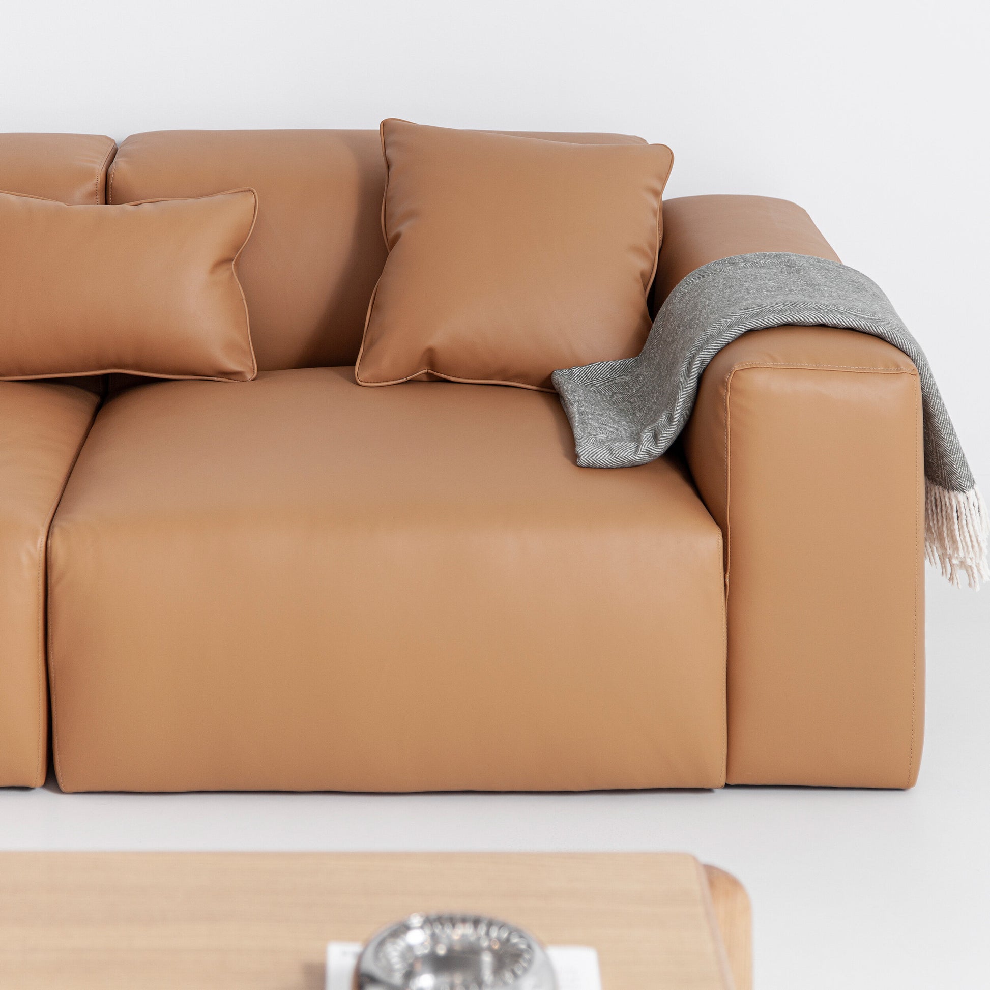 Porventura Deep sofa with plush cushions and modern design, shown in a cozy living room setting.