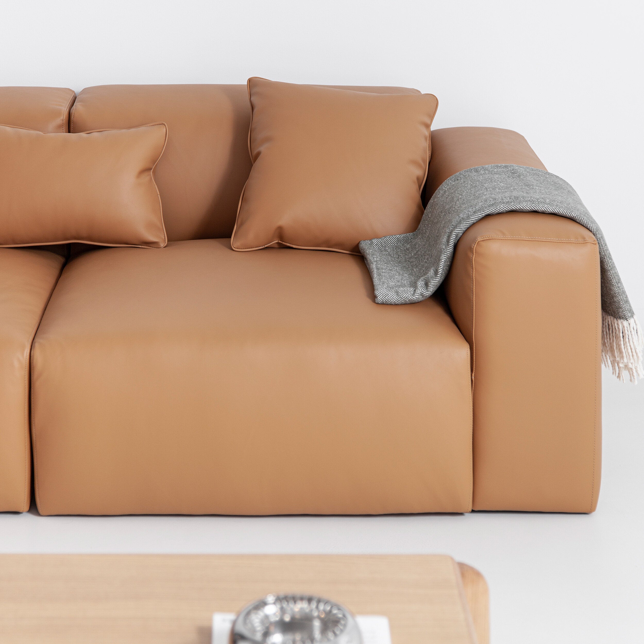 Porventura Deep sofa with plush cushions and modern design, shown in a cozy living room setting.